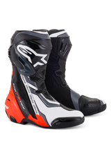 Alpinestars Supertech R Boots, high-performance motorcycle racing footwear, Black Red Fluo White and Gray, featuring a prominent white Astar logo on the shin plate, repeating 'alpinestars' text on the side, and bright fluorescent red accents on the heel and lower side.