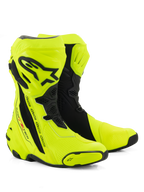 Alpinestars Supertech R Boots, Motorcycle Racing Boots, Yellow Fluo and Black, featuring a protective shin plate with Alpinestars logo, flexible accordion panels, and reinforced toe sliders on a white background