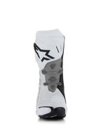 Botas Alpinestars Supertech R Vented, blanco, gris medio y negro, vista trasera que muestra la construcción de microfibra perforada, placa de talón gris rediseñada con textura de panal, logotipo negro en la parte superior de la pantorrilla, calzado profesional de motociclismo para competición y deporte