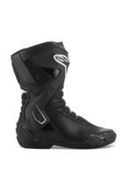 Botas Alpinestars Stella SMX-6 V3, botas de motociclismo de competición para mujer, negro y blanco, vista de perfil lateral con refuerzo de tobillo de TPU y protectores de espinilla, paneles de malla transpirable, logotipo blanco de Alpinestars en la parte frontal, diseñadas para rendimiento en pista y calle