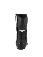 Botas Alpinestars Stella SMX-6 V3, botas de moto para mujer, en color negro y blanco, vista trasera con protector de talón de TPU y paneles de acordeón flexibles, diseño duradero de alto rendimiento