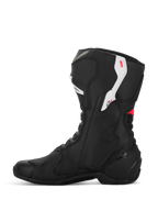 Botas Alpinestars Stella SMX-6 V3, botas de moto para mujer, negro, blanco y rosa diva, vista de perfil lateral, con construcción de microfibra, protección de TPU en tobillo y espinilla, y diseño de rendimiento aerodinámico para conducción en pista y calle.