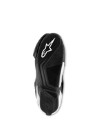 Botas Alpinestars SMX S, negro y blanco, vista inferior de la suela de compuesto de goma exclusivo, con logotipo Astar blanco y patrón de agarre texturizado para tracción y soporte.