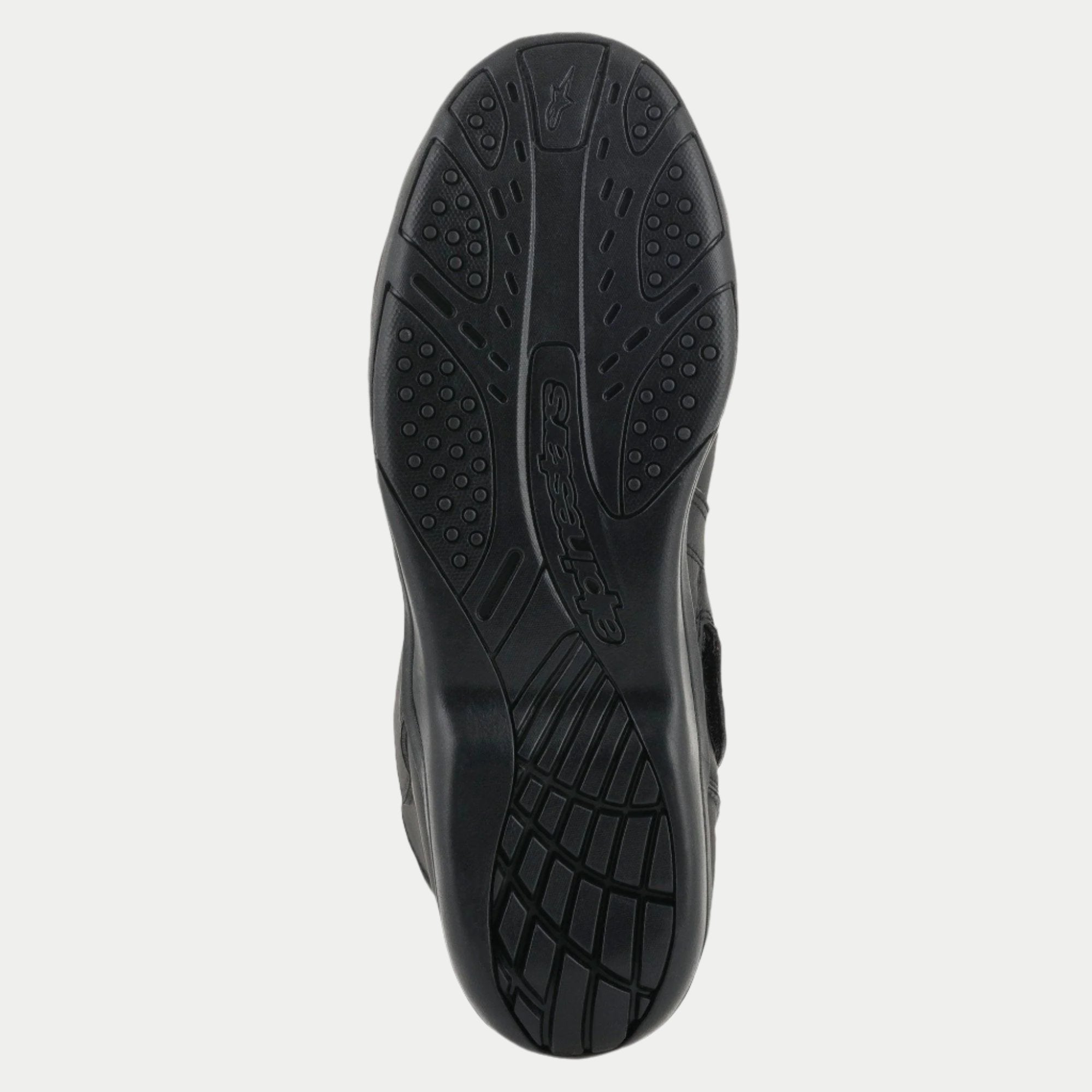 Alpinestars Origin Drystar® Boots, Black, detailed view of the rubber outsole, textured grip pattern with embossed logo, durable sole for motorcycle touring