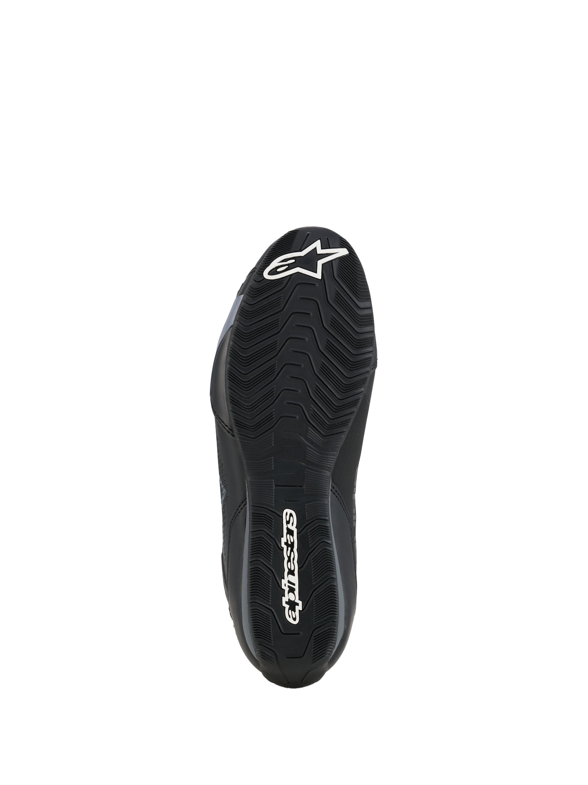 Zapatillas Alpinestars Celer, vista de la suela, compuesto de goma negra resistente al aceite con patrón de agarre ondulado texturizado, con logotipos blancos de Alpinestars en la puntera y el talón, diseñadas para tracción en las estriberas de la moto