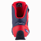 Alpinestars Austin Riding Shoe, azul marino y rojo brillante, vista trasera que muestra el contrafuerte del talón de TPU reforzado, forro de malla roja y suela de goma texturizada, calzado deportivo para motociclismo