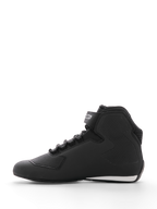 Alpinestars Sektor Shoe, Motorcycle Riding Shoe, Black, side profile view, featuring a sleek microfiber upper with honeycomb textured ankle panels, speed lacing system, ankle strap with logo, and a white accent on the heel, designed for road and sport riding