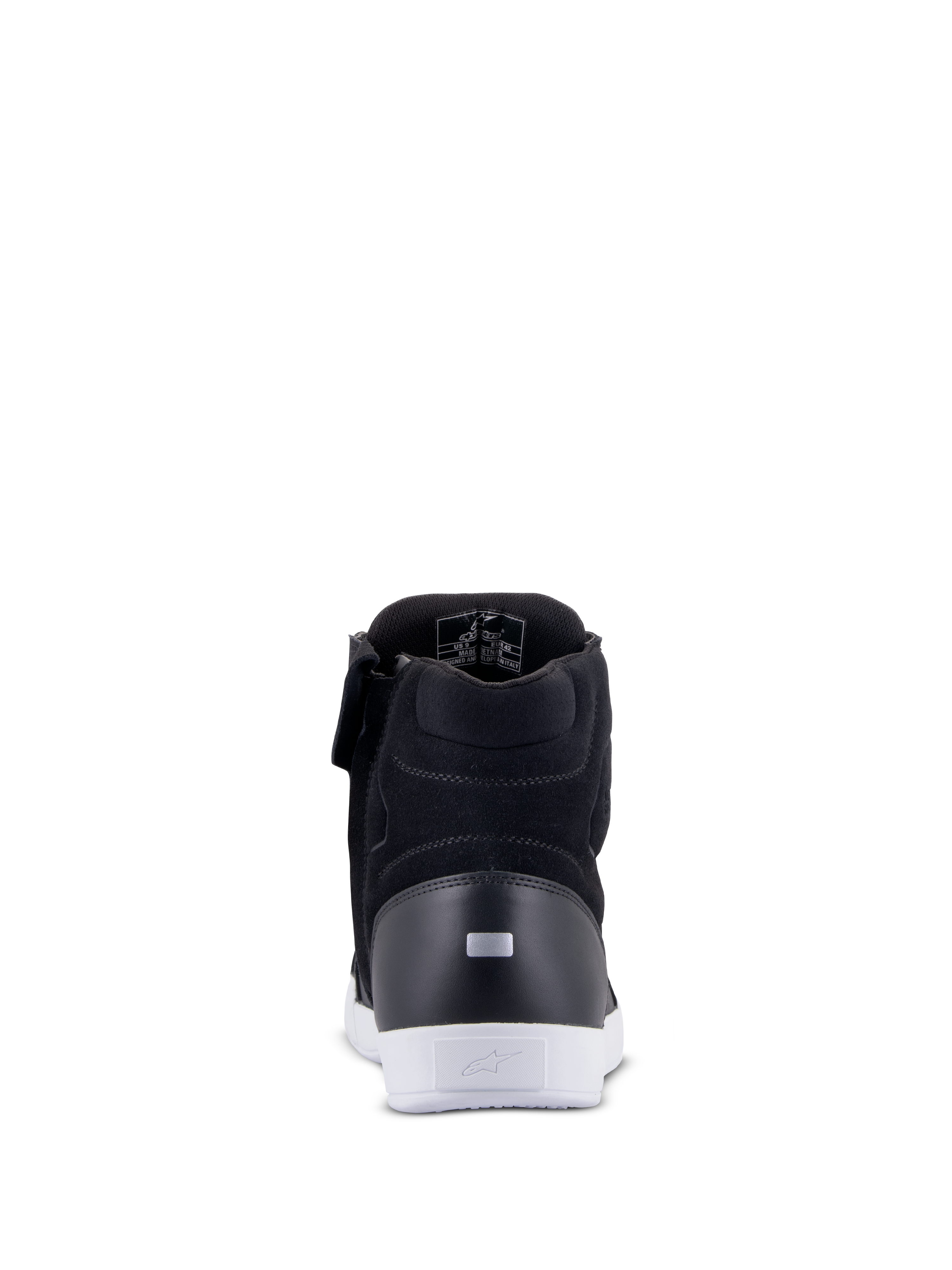 Zapatos Alpinestars Chrome Drystar®, zapatos de moto urbanos, negro y blanco, vista trasera que muestra la lengüeta reflectante del talón, suela urbana blanca con logotipo, construcción de cuero y ante para comodidad en la conducción urbana