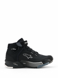 Alpinestars CR-X Women's Drystar Riding Shoes, zapatillas de moto negras de caña alta, vista lateral de calzado urbano para mujer con cierre de cordones y correa de velcro, logo de estrella blanco de Alpinestars, marcas 'Drystar' y 'TPF' en la entresuela, suela de goma resistente con patrones en blanco y gris.