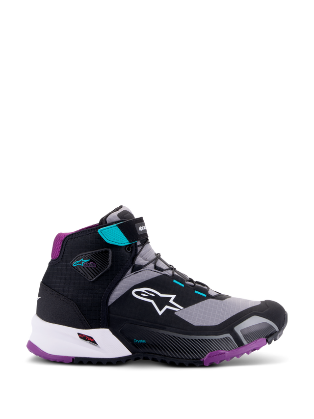 Zapatillas Alpinestars CR-X Women's Drystar®, negro gris ciruela verde azulado, calzado de motociclismo de caña alta, logo blanco de Alpinestars en el lateral, suela y acolchado del talón en púrpura, detalles en verde azulado en la correa del tobillo y ojales, diseño deportivo y elegante para turismo y desplazamientos
