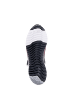 Alpinestars CR-X Women's Drystar® Riding Shoe, calzado para motociclismo, vista inferior de la suela, con la marca TPF Transversal Protection Frame en la sección blanca de la puntera, patrón de dibujo negro multidireccional y talón gris con el logotipo de la estrella.
