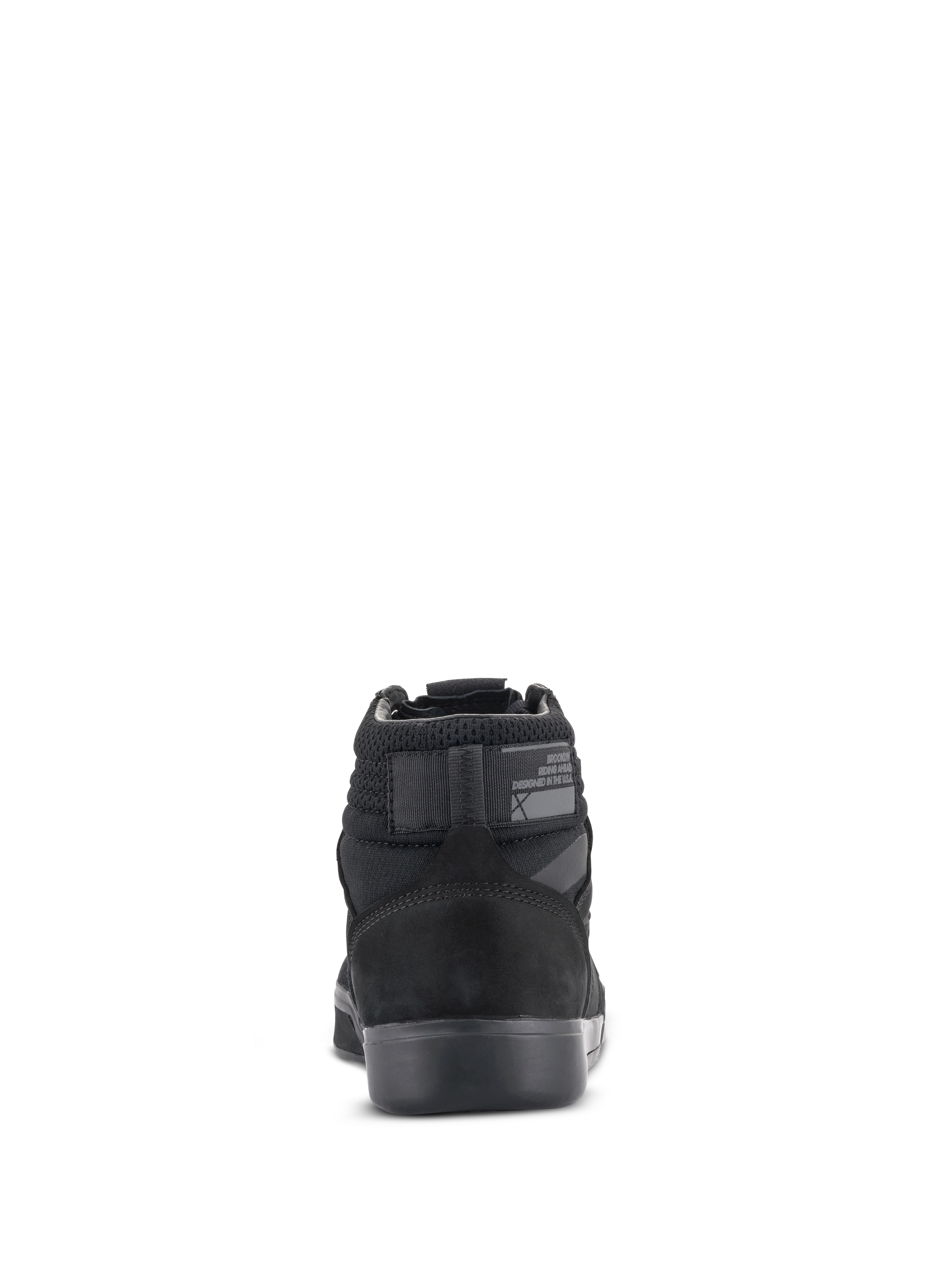 Zapatos de moto Alpinestars Primer, negro sobre negro, vista trasera que muestra el talón reforzado, cuello de malla y suela de goma, calzado urbano protector para motociclismo