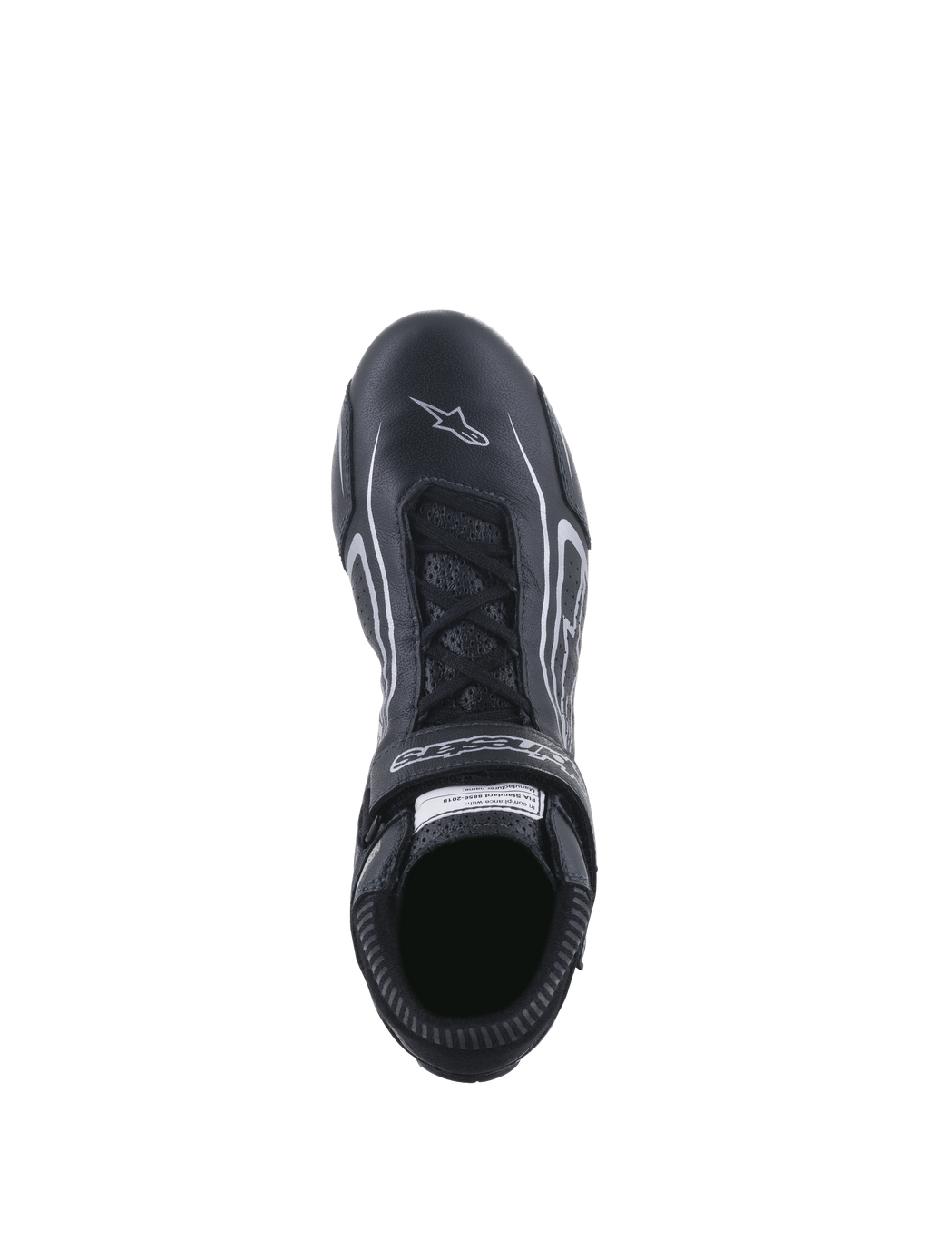 Zapatos Tech-1 T V3 FIA de Alpinestars, calzado para automovilismo, negro y plateado, vista superior que muestra el sistema de cordones y la correa de velcro con la marca, cuero de vaca de plena flor con el logo de la estrella blanca en la puntera, calzado profesional para automovilismo.