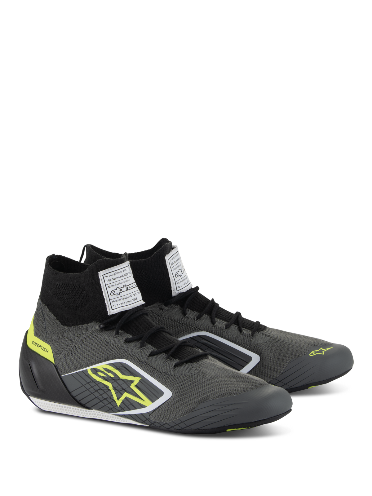 Zapatos Alpinestars Supertech, calzado para automovilismo, gris frío y negro con detalles en amarillo flúor, con parte superior de punto aramídico, talonera de fibra de carbono y etiquetas blancas de certificación FIA en la lengüeta, diseño profesional de competición