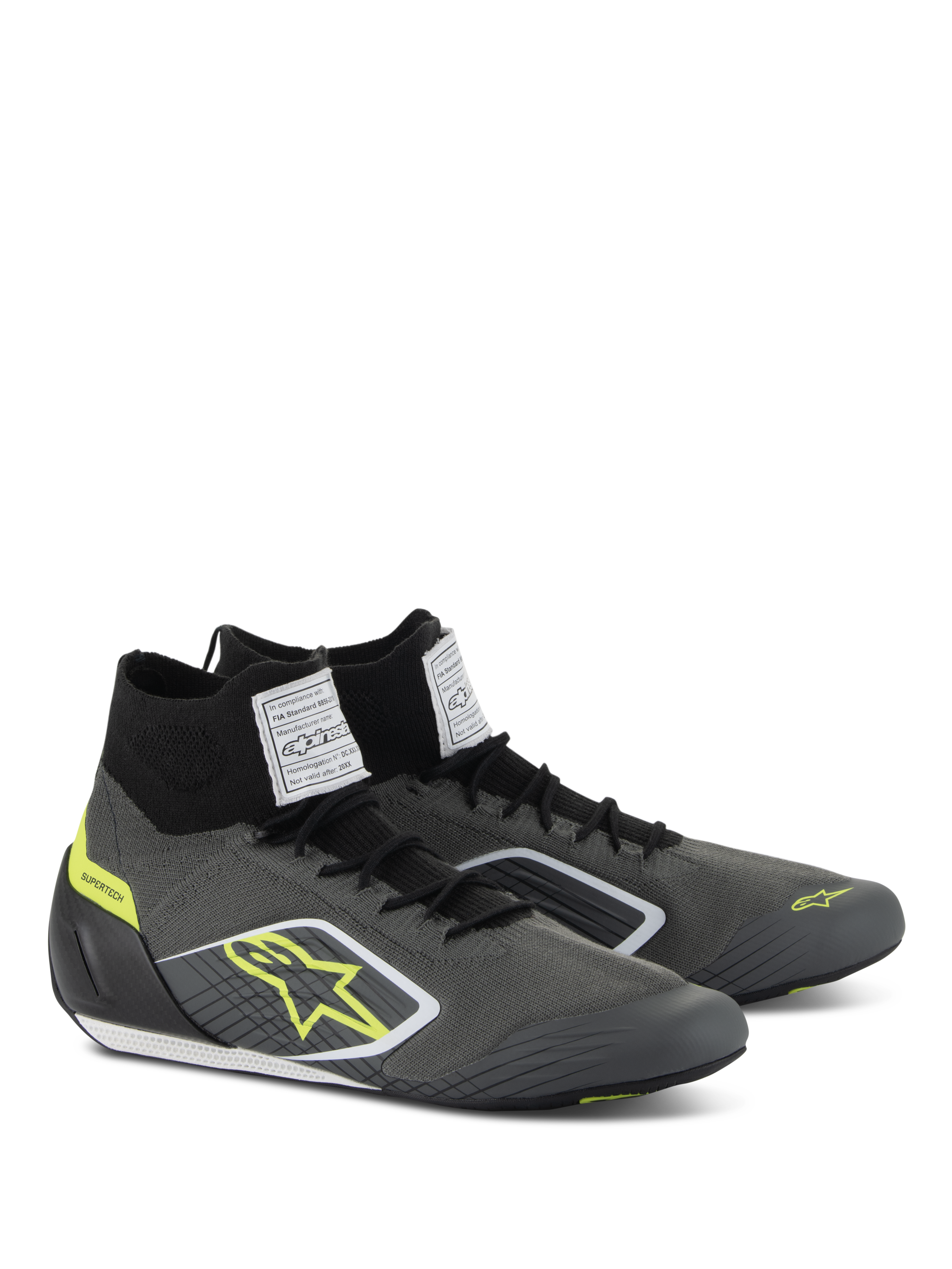 Zapatos Alpinestars Supertech, calzado para automovilismo, gris frío y negro con detalles en amarillo flúor, con parte superior de punto aramídico, talonera de fibra de carbono y etiquetas blancas de certificación FIA en la lengüeta, diseño profesional de competición