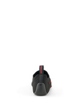 Alpinestars Tech Gaming Shoes, Black, back view showing the seamless knitted upper, textured rubber heel with star logo, and rear pull tab with red branding, SIM-racing footwear
