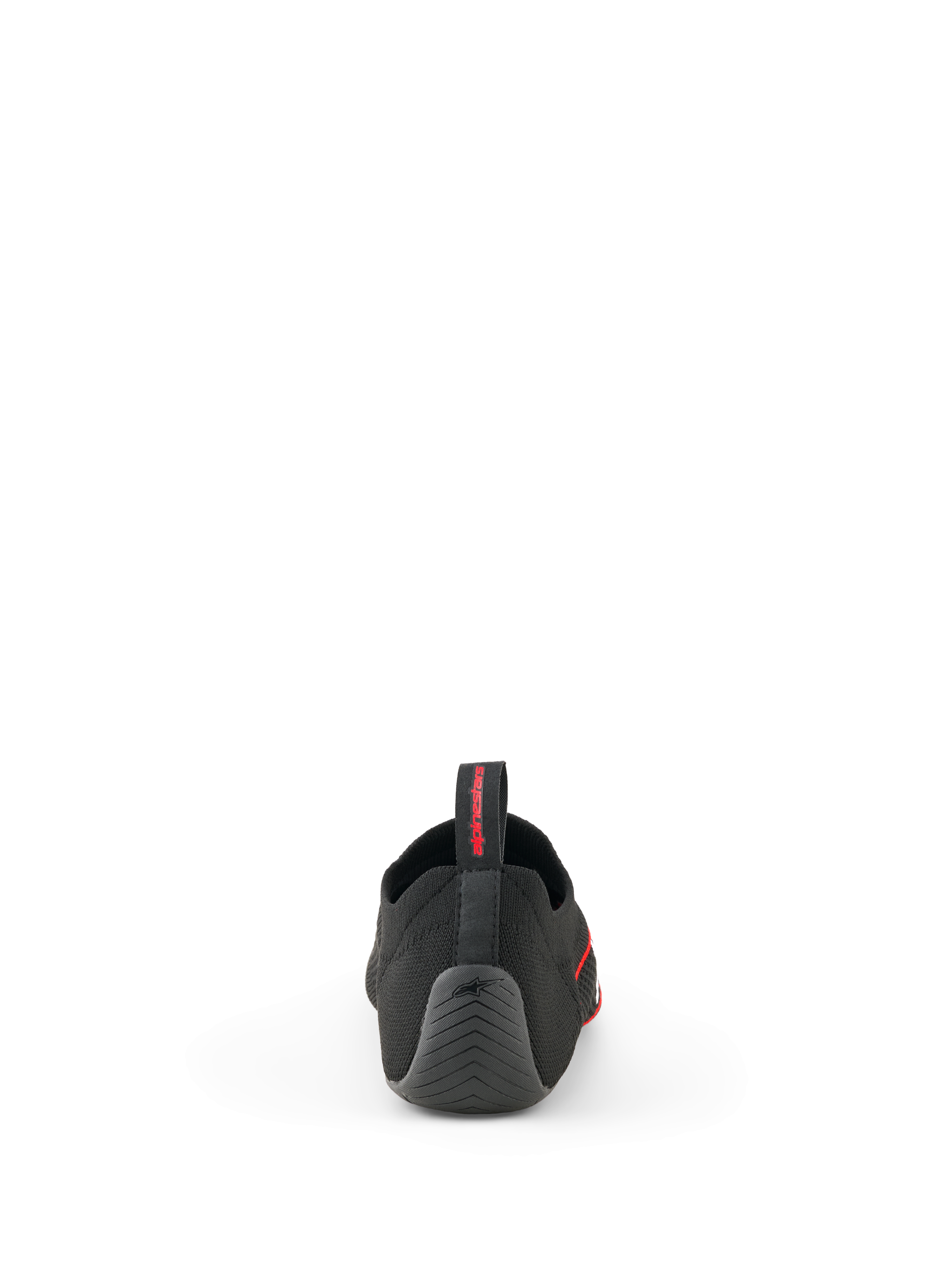 Alpinestars Tech Gaming Shoes, Black, back view showing the seamless knitted upper, textured rubber heel with star logo, and rear pull tab with red branding, SIM-racing footwear