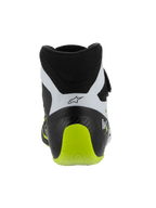 Zapatillas Alpinestars Tech-1 KX V3, calzado de karting certificado por la FIA, negro, blanco y amarillo flúor, vista trasera que muestra el talón reforzado de una sola pieza, detalle en amarillo flúor brillante, paneles blancos con logotipo negro, calzado técnico de automovilismo para uso en pista