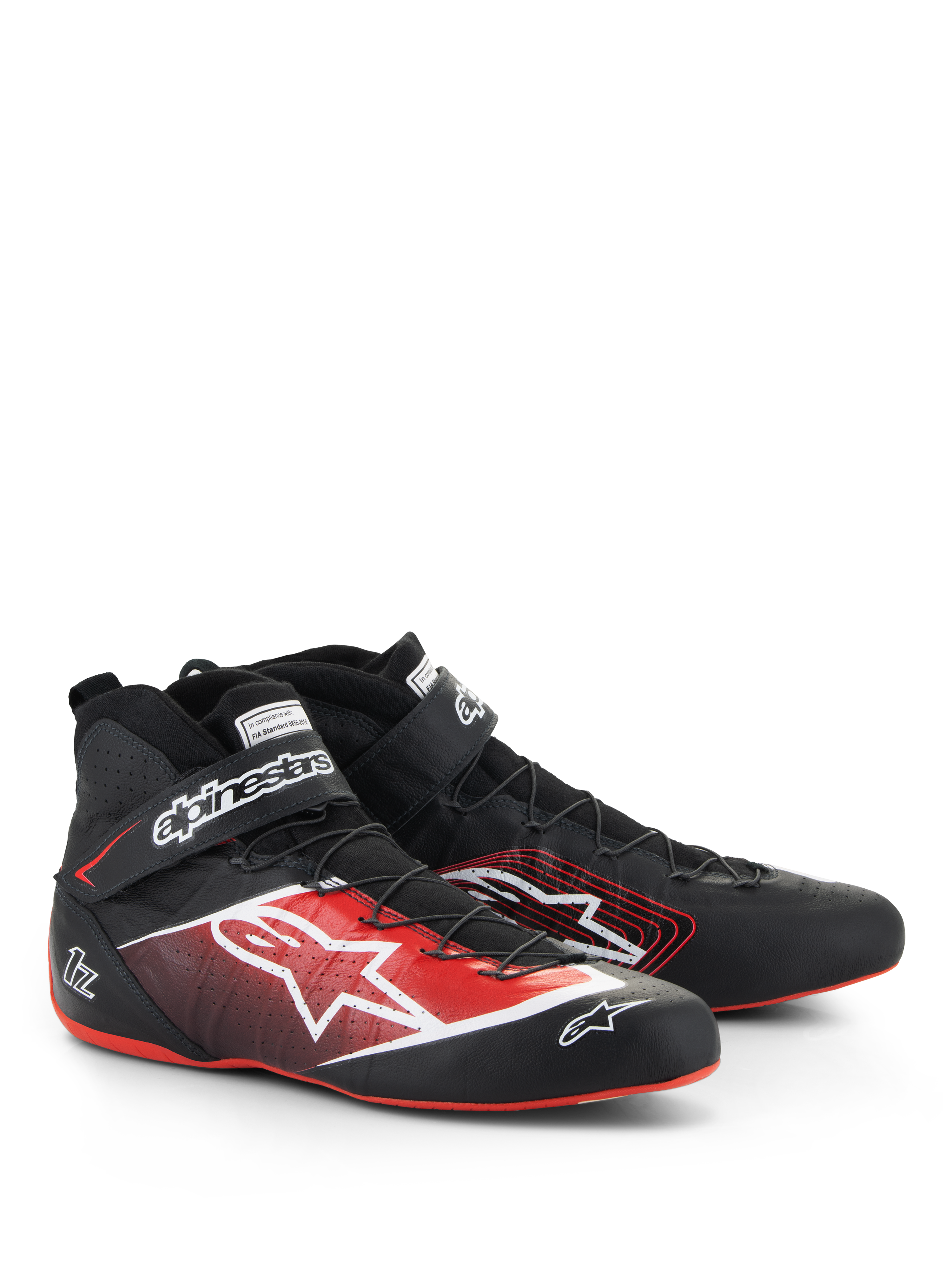 Alpinestars Tech-1 Z V3 Shoes FIA, zapatos de automovilismo, negros con detalles en rojo y blanco, con un gran logotipo de estrella blanca en el lateral, suelas rojas finas y sistema de cordones de alambre de precisión con correa en el tobillo