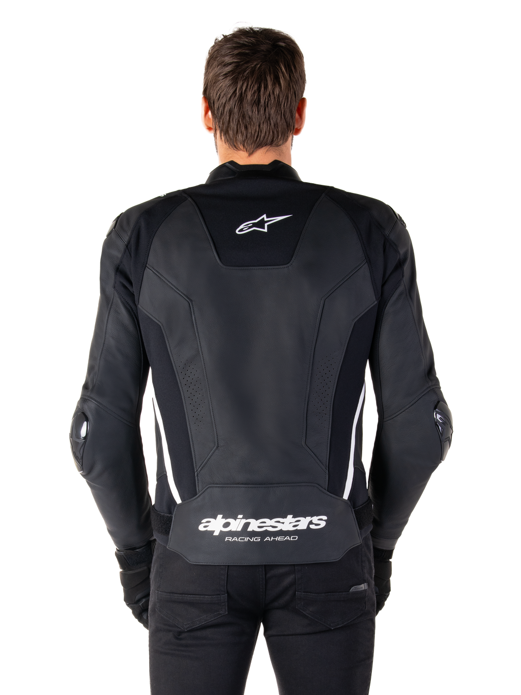 Vista posterior de la chaqueta de cuero Alpinestars Missile V3 en negro y blanco, con el logotipo de la estrella de Alpinestars en la parte superior de la espalda y la marca en la zona lumbar inferior, franjas verticales blancas y deslizadores externos en los codos, chaqueta deportiva de carreras de cuero premium.