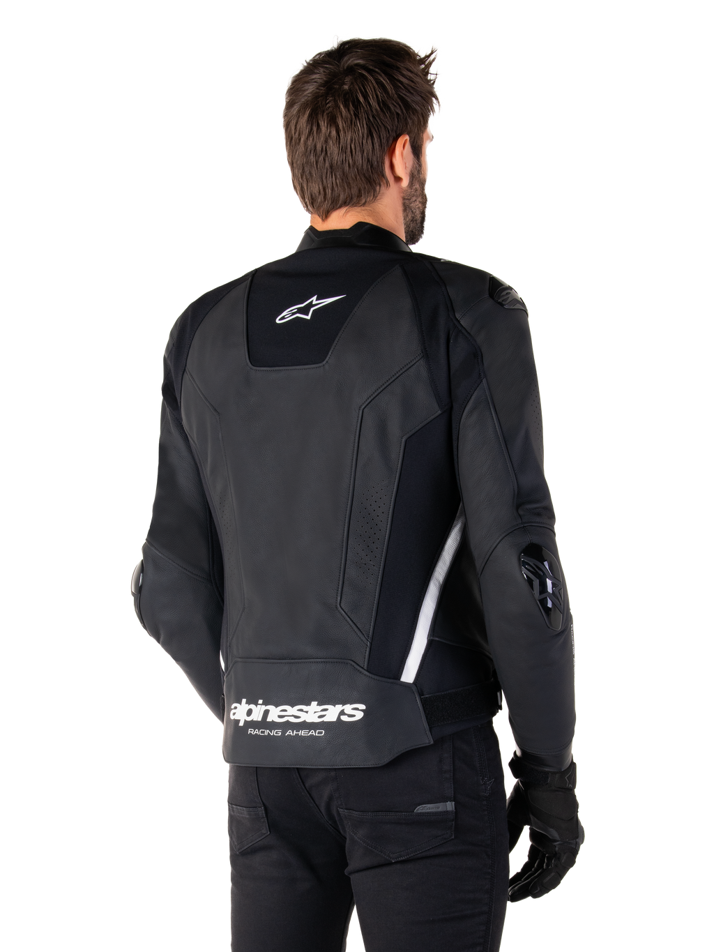 Chaqueta de cuero Alpinestars Missile V3, vista trasera, negro y blanco, con el logotipo de la estrella de Alpinestars en la parte superior de la espalda y el nombre de la marca en la parte inferior, deslizadores protectores en codos y hombros, equipamiento de carreras de cuero premium