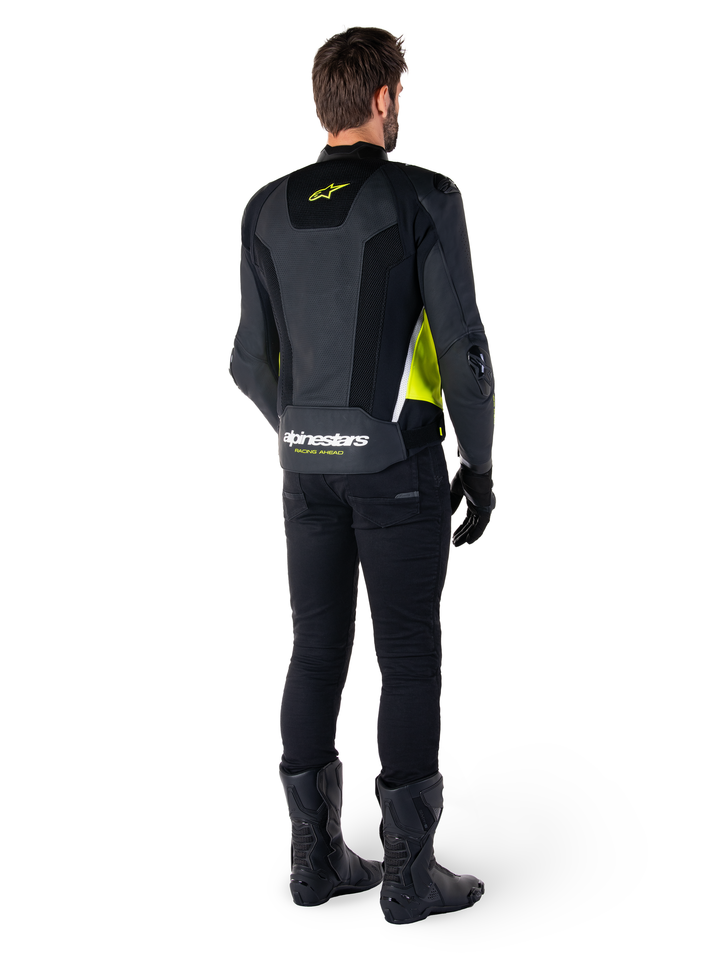 Alpinestars Missile V3 Airflow Leather Jacket, Black Yellow Fluo White, rear view on rider, featuring perforated leather back panels, yellow Alpinestars logo, and white accents, worn with black riding pants and boots