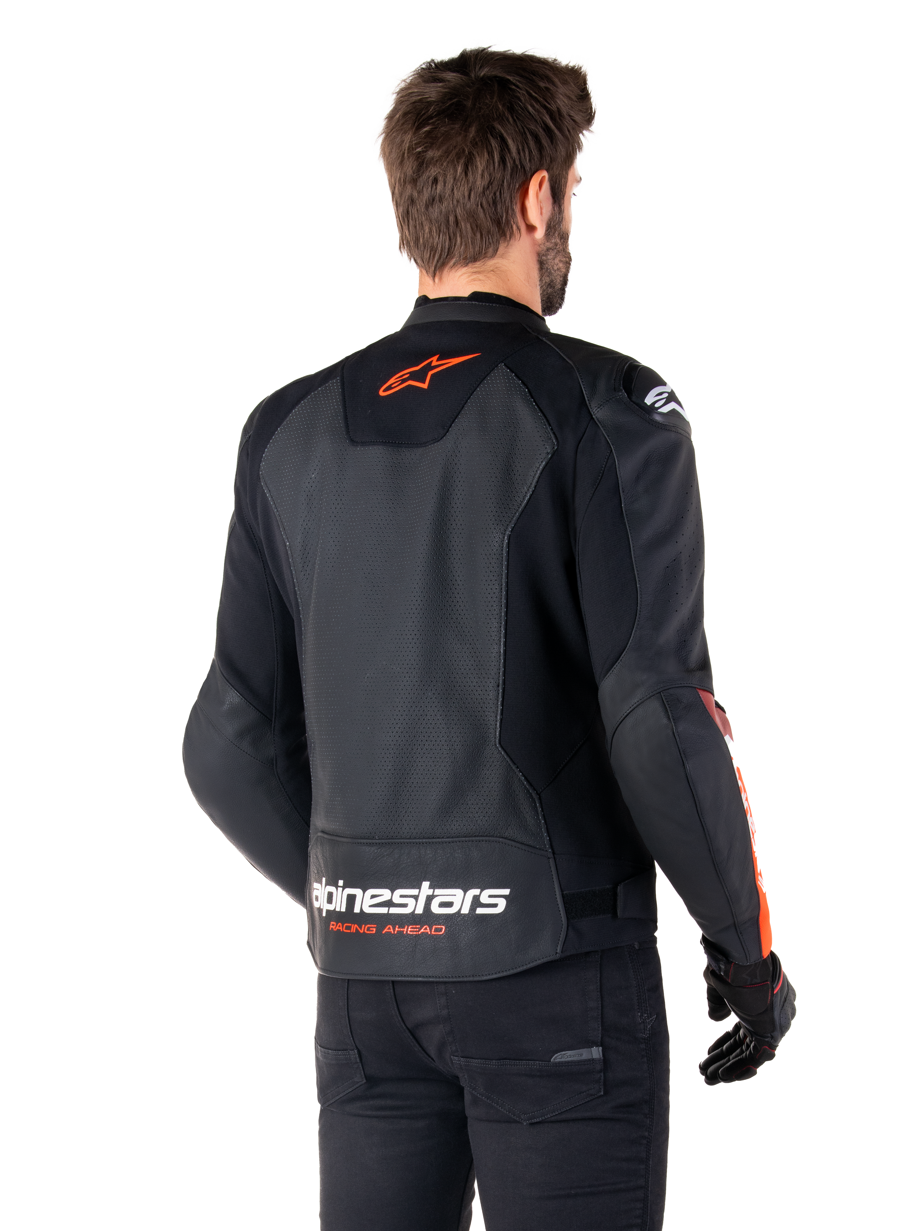 Alpinestars Faster V3 Airflow Leather Jacket, Sport Motorcycle Jacket, Black with Red Fluo, back view, featuring perforated leather panels, orange-red Alpinestars logo on upper back and white branding on the lower back, worn with black pants and gloves, sleek race-derived style