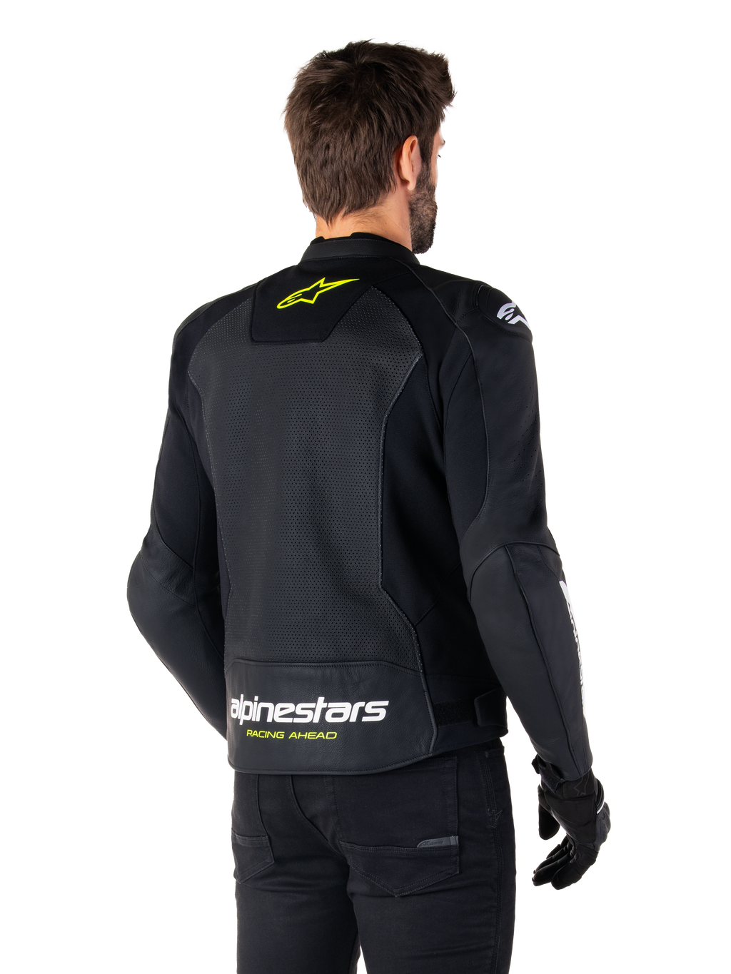 Chaqueta de cuero Alpinestars Faster V3 Airflow, negro, blanco y amarillo flúor, vista trasera, con un gran panel trasero de cuero perforado para ventilación, logo de estrella amarilla en el cuello y marca Alpinestars en blanco con el texto 'Racing Ahead' en amarillo en el dobladillo inferior, equipamiento deportivo para conducción de motocicleta