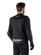 Chaqueta de cuero Alpinestars Faster V3 Airflow, negro, blanco y amarillo flúor, vista trasera, con un gran panel trasero de cuero perforado para ventilación, logo de estrella amarilla en el cuello y marca Alpinestars en blanco con el texto 'Racing Ahead' en amarillo en el dobladillo inferior, equipamiento deportivo para conducción de motocicleta