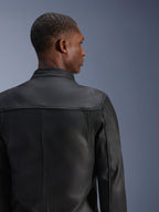Alpinestars Blacktrack Leather Jacket, Black, premium bovine leather motorcycle jacket shown from the back, featuring leather accordion panels on the shoulder blades and a perforated collar, tailored fit for urban riding
