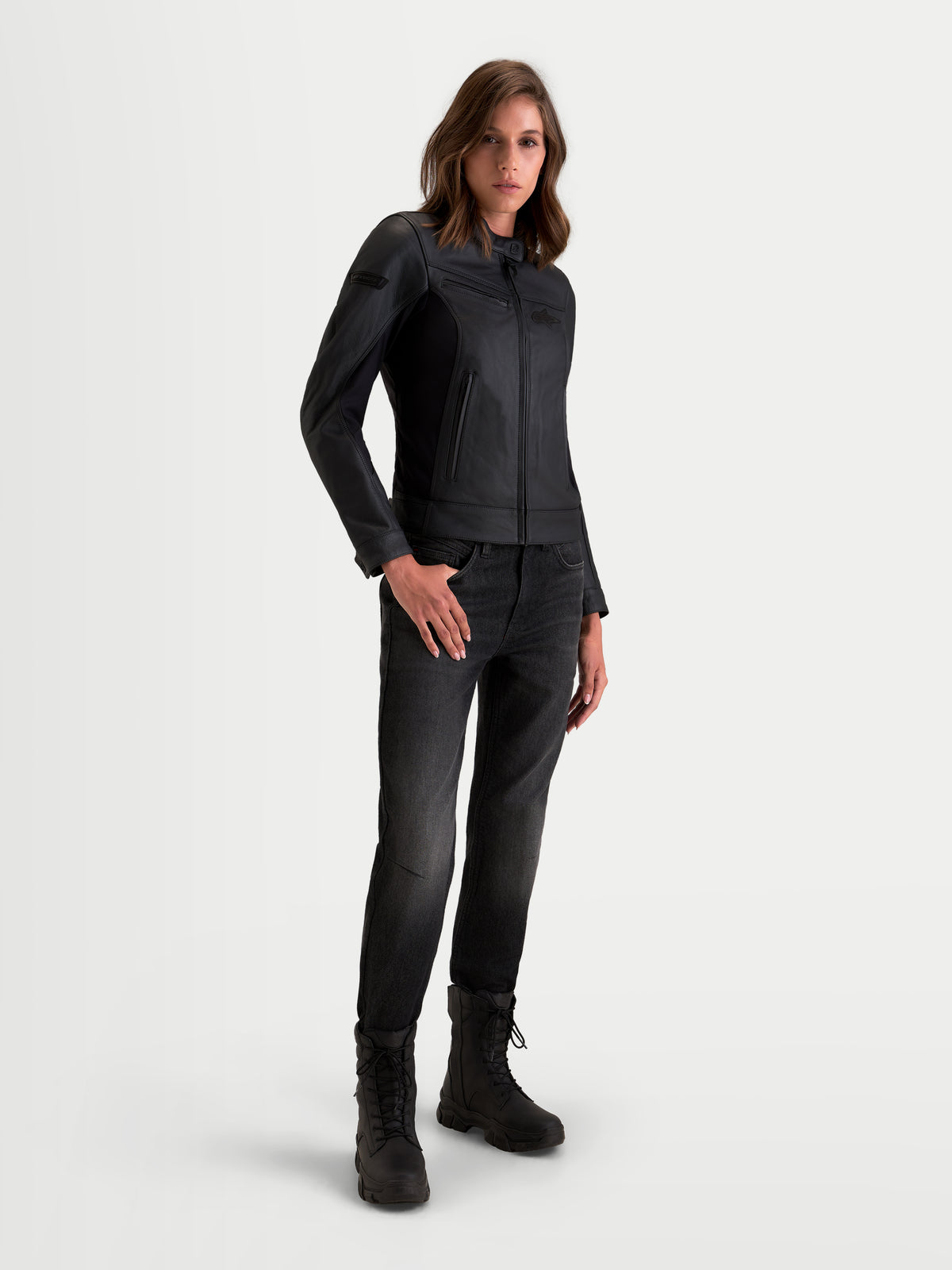 Alpinestars Stella Maver-X Leather Jacket, women's urban motorcycle leather jacket in black, on-model front three-quarter view showing premium bovine leather construction and tailored fit.