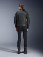 Alpinestars Stella Dyno Leather Jacket, Women's Motorcycle Jacket, Black, rear view highlighting the tailored bovine leather construction, minimalist heritage design, worn with black riding pants and boots for an urban motorcycle look