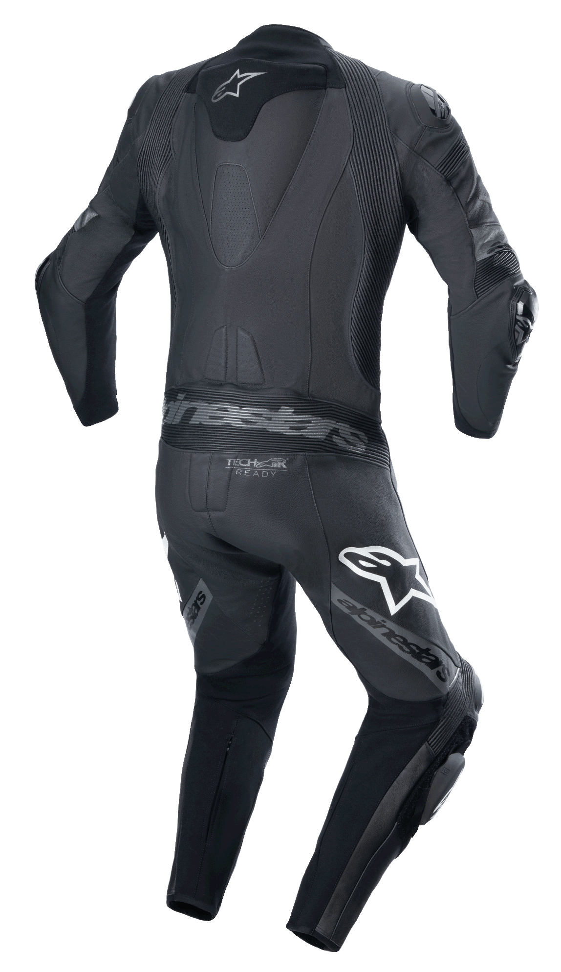 Mono de cuero Alpinestars Missile V2 Ward de una pieza, negro y gris metálico, vista trasera con joroba aerodinámica, paneles elásticos de acordeón en la parte baja de la espalda y los hombros, marca Alpinestars en los muslos y logotipo Tech-Air Ready