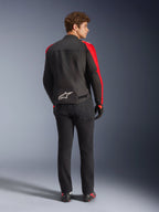 Alpinestars T-SPS V2 Waterproof Jacket, Black Red Red Fluo, back view on male model, white Alpinestars logo on the lower back, worn with black motorcycle pants and gloves, sporty textile waterproof riding jacket