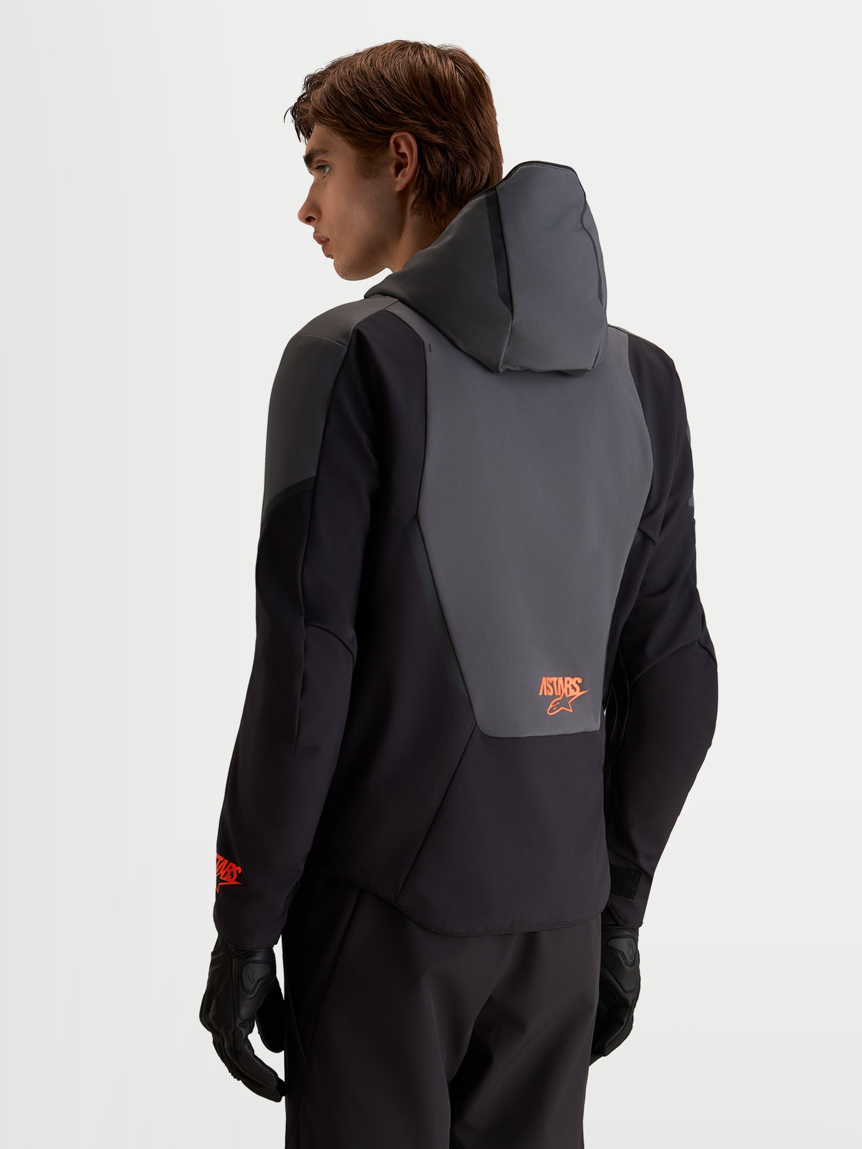 Alpinestars Aeroshell Waterproof Jacket, Men's Motorcycle Sport Softshell in Black and Dark Gray, featuring an integrated hood and back panel detail