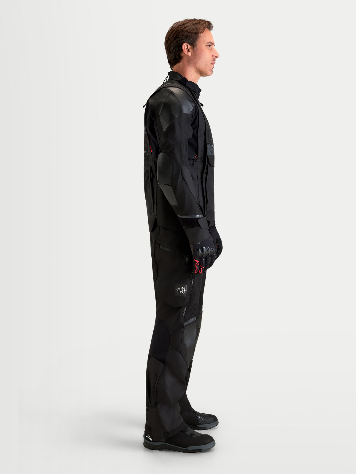 Alpinestars Harok V2 Drystar Jacket, Men's Black all-terrain adventure motorcycle jacket featuring modular ventilation, CE Level 2 armor, and recycled ripstop construction, shown worn by a male model in profile view