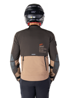 Alpinestars AMT-8 Stretch Drystar® XF Jacket, back view, Dark Brown and Dark Khaki two-tone design, featuring Alpinestars Motion Technology branding, zippered rear cargo pocket, and protective elbow panels, adventure touring motorcycle apparel