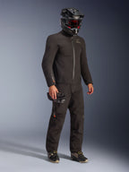 Alpinestars AMT-8 Stretch Drystar® XF Jacket in Black, worn as part of a full riding kit with matching pants and a black helmet, featuring a sleek textile design with orange Drystar XF branding on the sleeve, ideal for adventure touring.