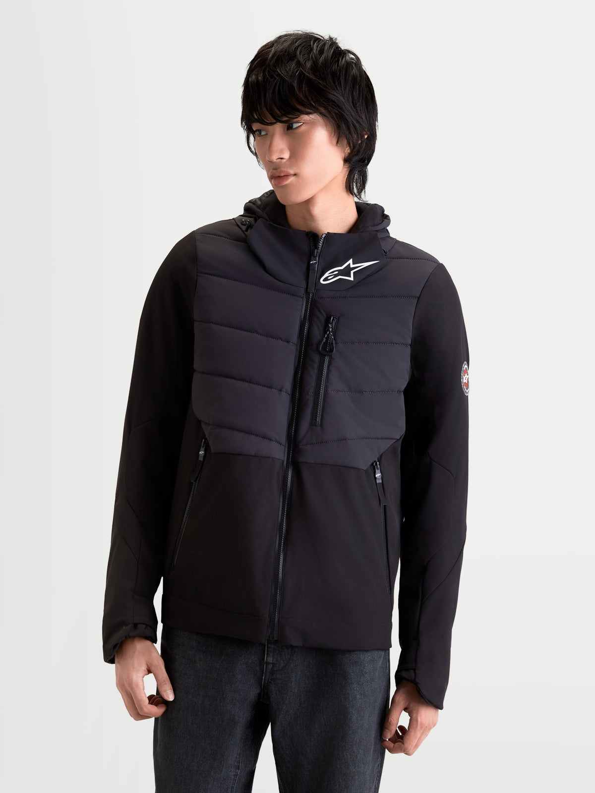 Alpinestars Therma-Tech Waterproof Jacket, men's urban contemporary motorcycle riding jacket in black, front view on a model wearing the insulated textile jacket featuring sonic-welded down construction, hood, and protective features.