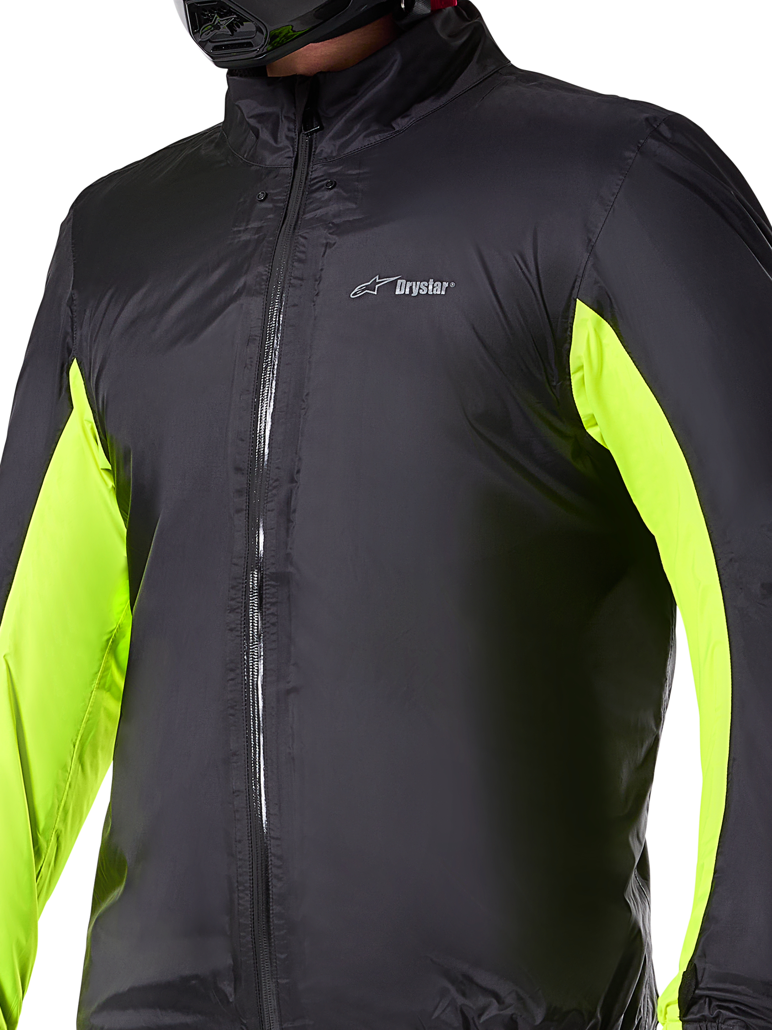 Forro impermeable de la chaqueta Alpinestars Bogotá Pro Drystar®, capa técnica para motociclismo, negro con paneles amarillo neón en los brazos, cierre de cremallera frontal y logo Drystar en el pecho, diseñado para protección en la conducción bajo cualquier clima