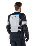 Alpinestars Bogota' Pro Drystar® Jacket, Adventure Motorcycle Jacket, Ice Gray Black and Cyan, back view highlighting the large gray rear panel with Tech Touring branding, cyan accents on sleeves, and durable textile construction.