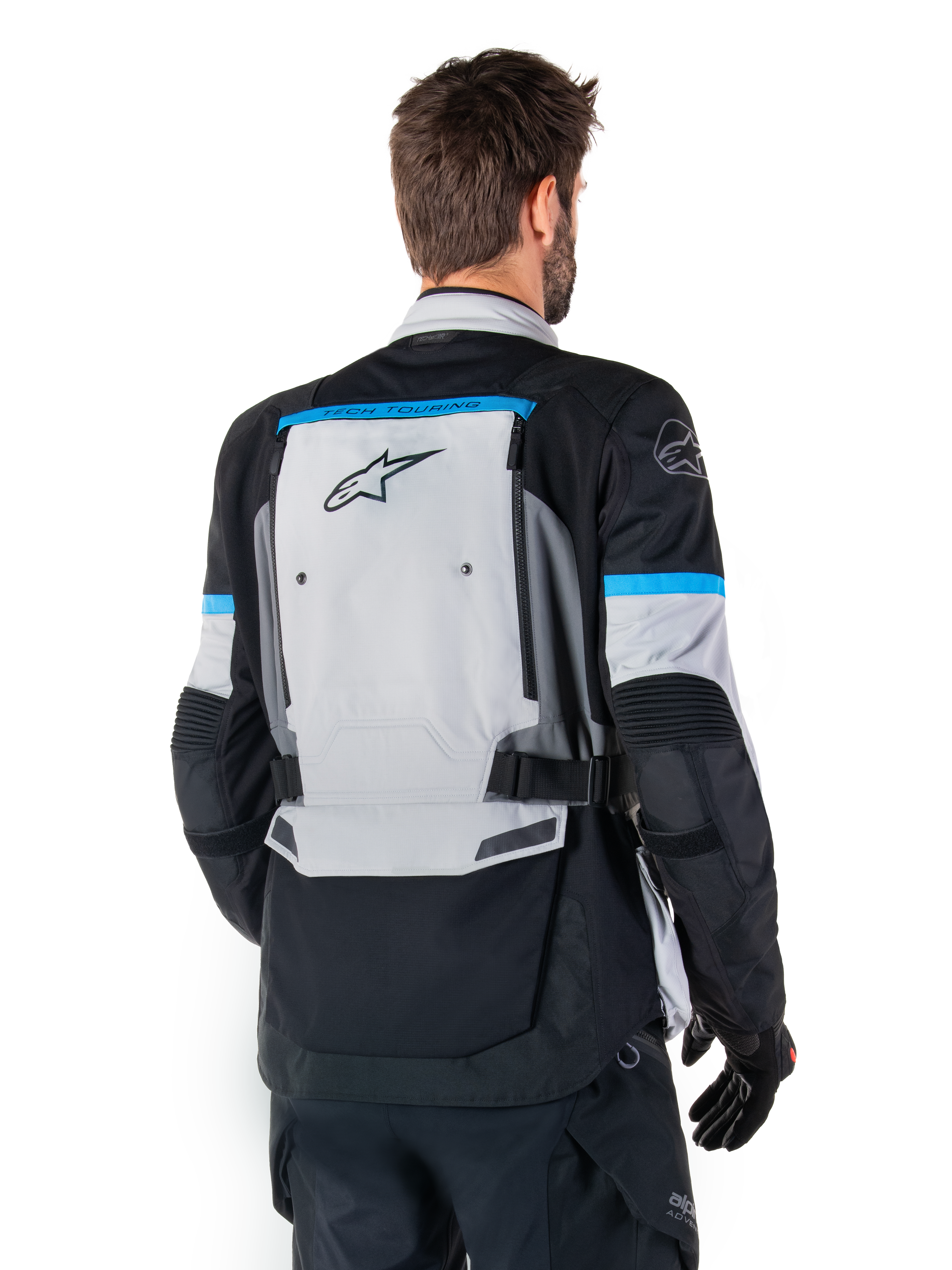 Alpinestars Bogota' Pro Drystar® Jacket, Adventure Motorcycle Jacket, Ice Gray Black and Cyan, back view highlighting the large gray rear panel with Tech Touring branding, cyan accents on sleeves, and durable textile construction.