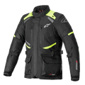 Chaqueta Alpinestars Andes V3 Drystar, chaqueta de moto touring, negra con detalles en amarillo fluorescente, con ventilaciones en el pecho con cremallera, bolsillos cargo frontales grandes, correas de ajuste en la cintura y logotipos de Alpinestars, equipamiento técnico impermeable para aventura