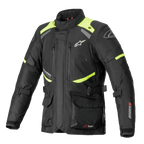 Chaqueta Alpinestars Andes V3 Drystar, chaqueta de moto touring, negra con detalles en amarillo fluorescente, con ventilaciones en el pecho con cremallera, bolsillos cargo frontales grandes, correas de ajuste en la cintura y logotipos de Alpinestars, equipamiento técnico impermeable para aventura