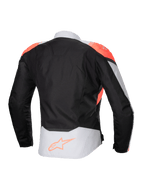 Chaqueta impermeable Alpinestars Stella T-Jaws V4, chaqueta de moto para mujer, color negro, gris hielo y coral fluorescente, vista trasera con detalles en coral fluorescente en los hombros y logotipo de Alpinestars en la parte inferior de la espalda, construcción en tejido técnico para conducción en cualquier clima.