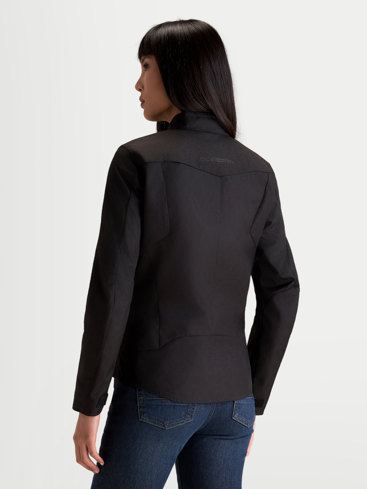 Alpinestars Stella C-1 Waterproof Jacket, women's urban motorcycle textile jacket in black, rear view showing 3D back construction and soft collar worn by a model.