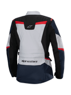Chaqueta Alpinestars Stella ST-1 Waterproof, vista trasera, azul oscuro y negro con detalles en gris claro y rojo brillante, chaqueta de turismo de aventura para mujer con marca Alpinestars y construcción ergonómica.