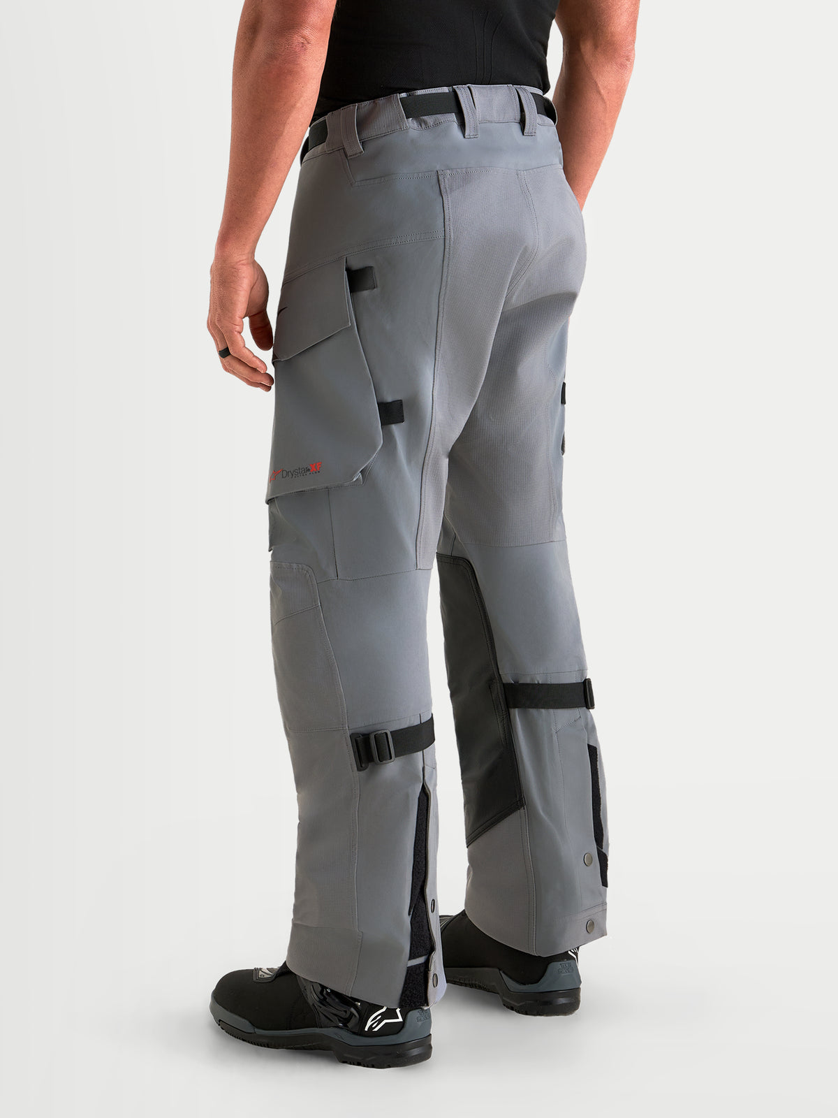 Alpinestars Maxdura Drystar XF Laminated Pants, Men's Adventure Motorcycle Pants, Dark Gray and Black, waterproof textile riding trousers with cargo pockets and adjustable lower legs, rear view on model