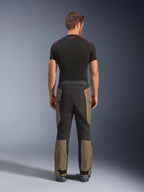 Alpinestars Cusco Drystar® Pants, Adventure Motorcycle Pants, Walnut Black, back view showing brown and black paneling, durable ripstop construction, worn with a black base layer shirt
