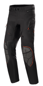 Alpinestars AMT-10R Drystar XF Pants, Adventure Touring Motorcycle Pants, Black with Orange Accents, featuring grey Superfabric knee reinforcements, adjustable waist belt, zippered pockets, and waterproof laminated design